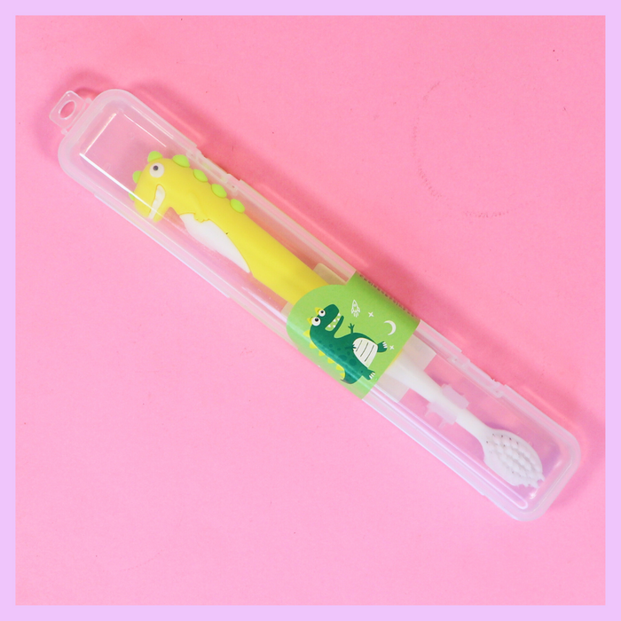 Yellow and green dinosaur toothbrush
