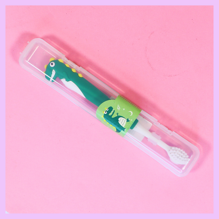 Green dinosaur toothbrush
