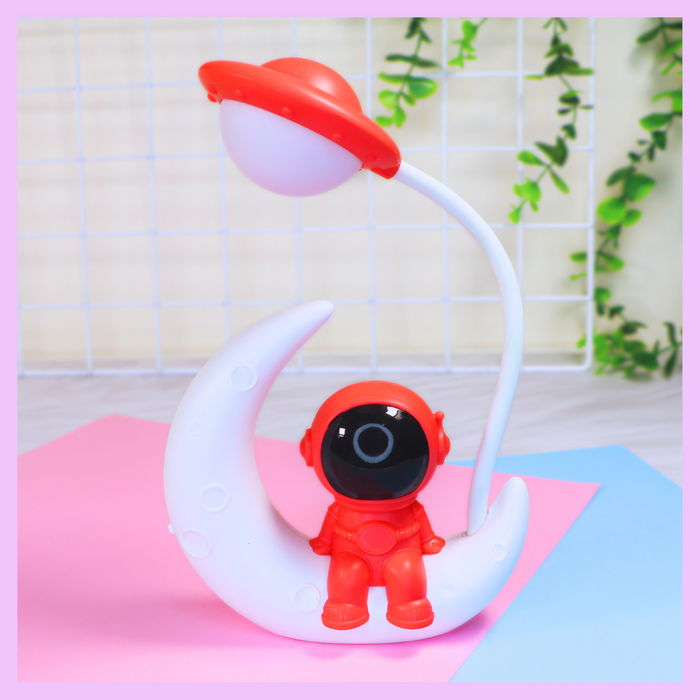 Red astronaut LED desk lamp for space themed decor