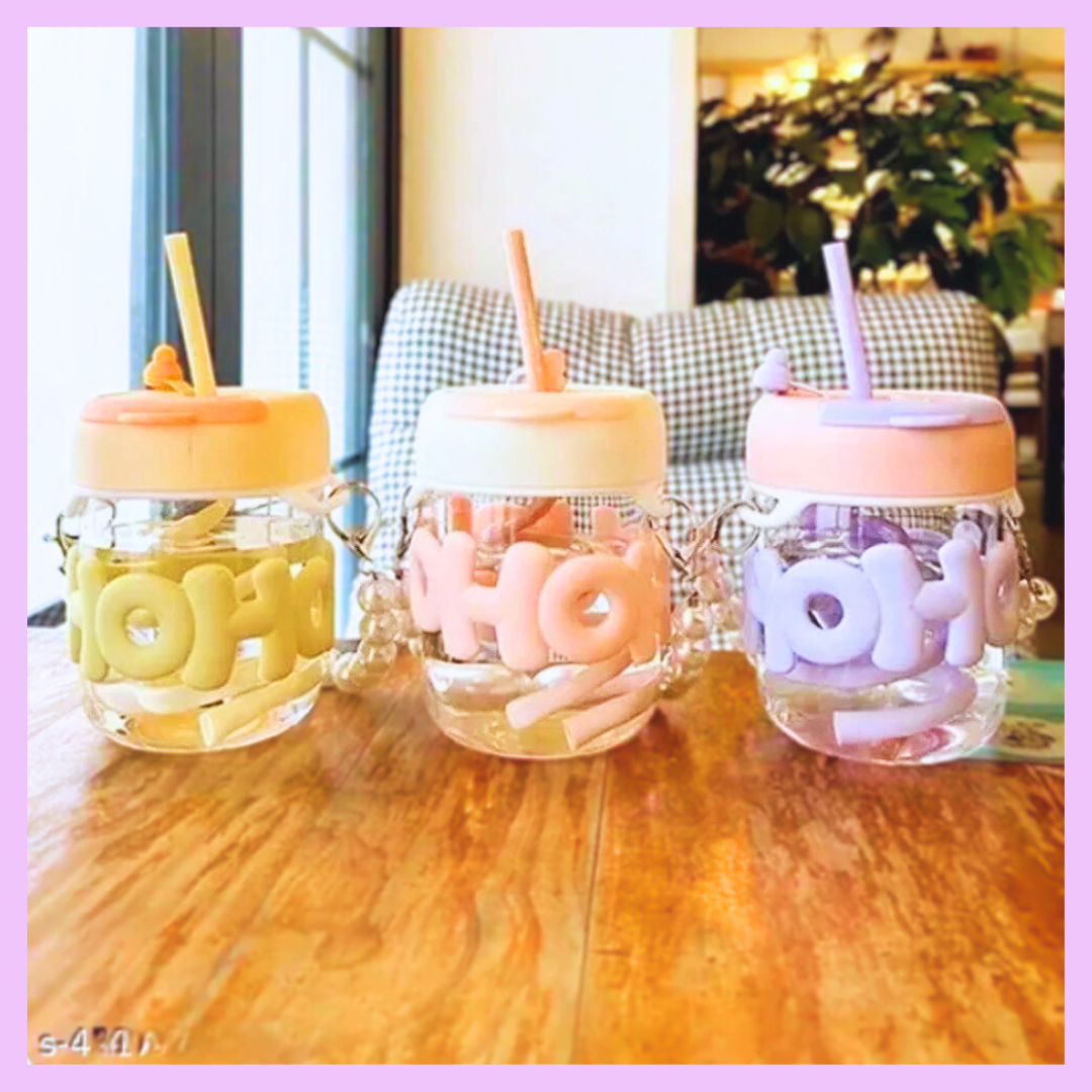 Glass coffee cup with silicone lid and reusable glass straw