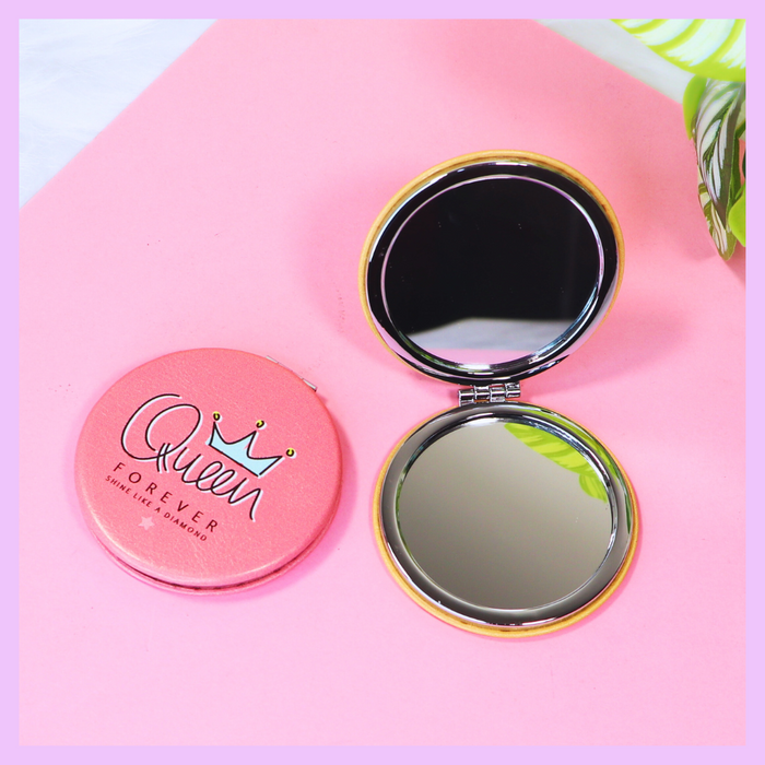 Round pocket mirror with Queen Forever orange design