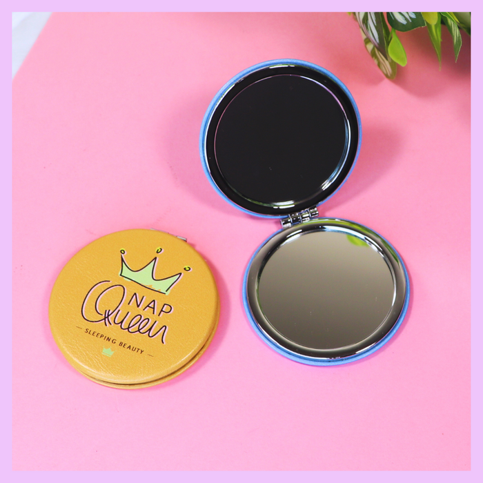 Round pocket mirror with Nap Queen design