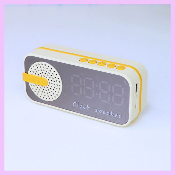 Beige digital clock with speaker