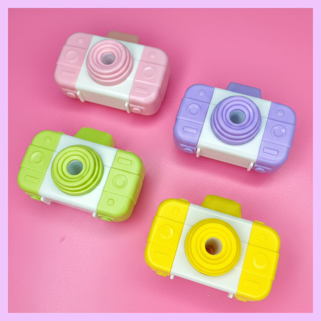 Pink camera shaped pencil sharpener with eraser